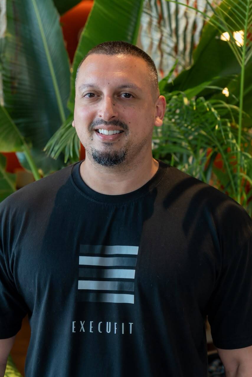 Portrait of Christopher Mallett, founder of Execufit, wearing the Execufit brand t-shirt